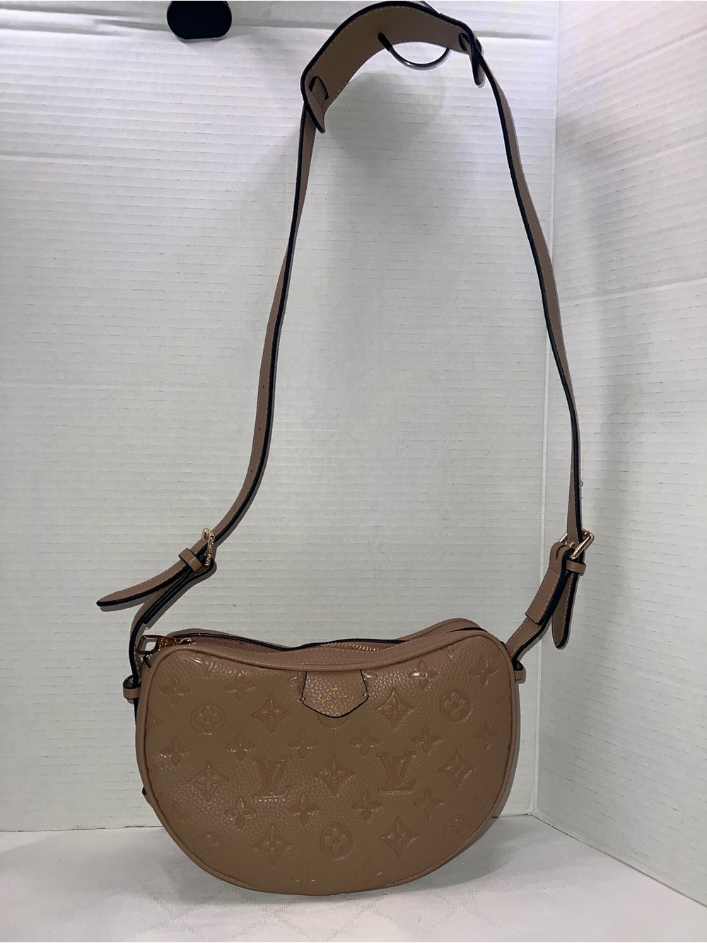Designer inspired half-moon shoulder bag in a neutral taupe leather w/monogram
